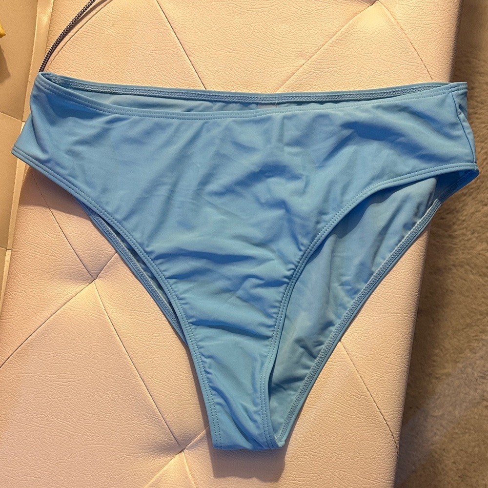 BRAND NEW bikini with hygienic liner. Gorgeous sky blue, high cut leg. Stunning!
